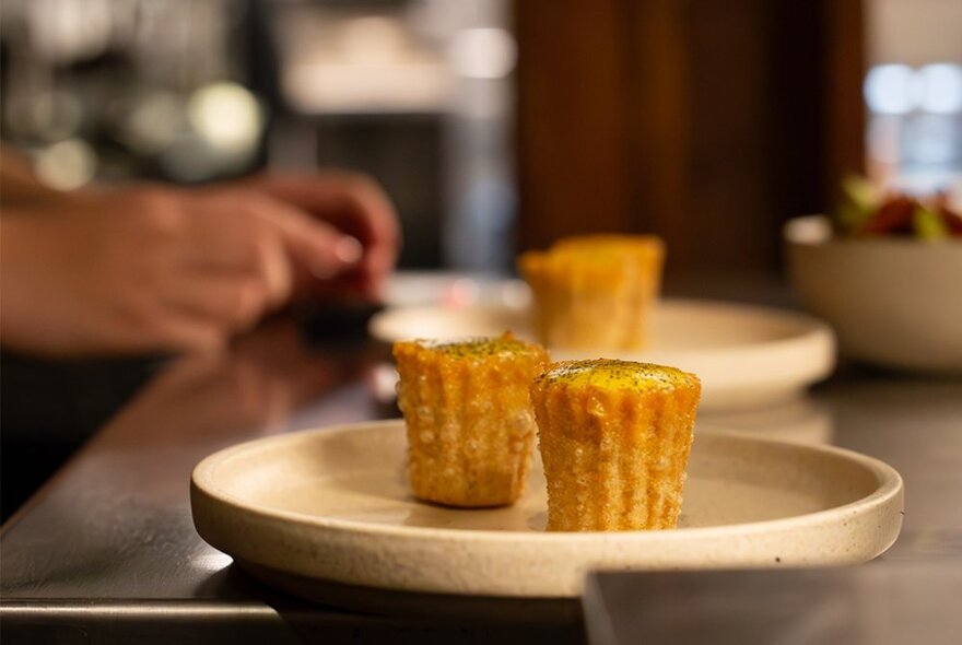 A plate of food at the kitchen pass, waiting to be delivered to the diner.