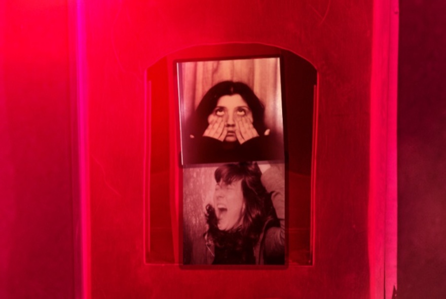 Photo booth images of a girl screaming and pulling a face with a red background.