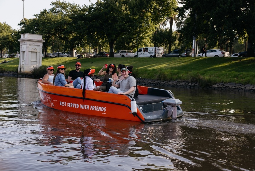 A group of people on a small boat on the Yarra River in Melbourne.