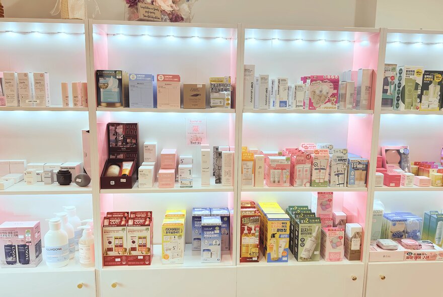 Shelves of skincare and cosmetic products in a shop.