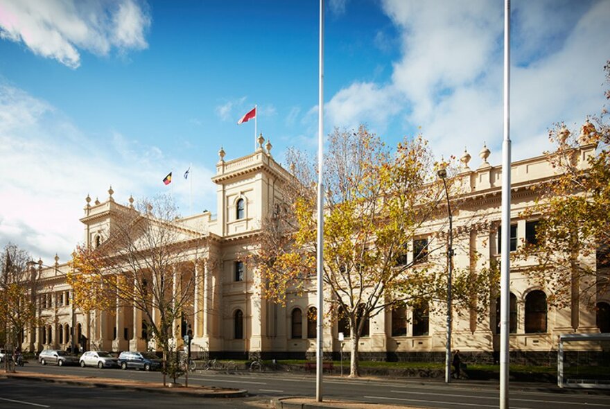 The Victorian Trades Hall building with a lightly clouded blue sky in the background. 