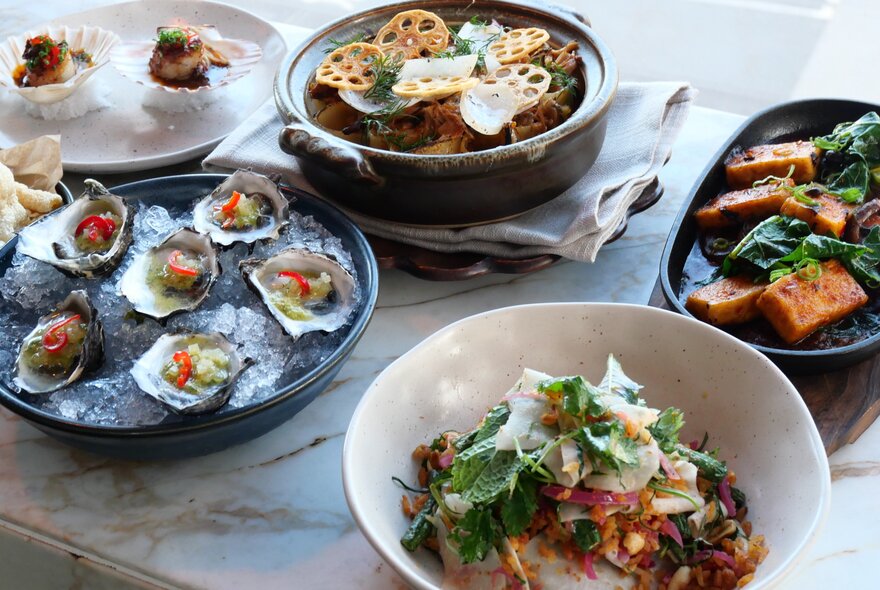 Plates of food on a restaurant table at Taxi Kitchen.
