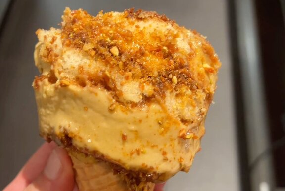 Close up of tiramisu ice cream in a cone.