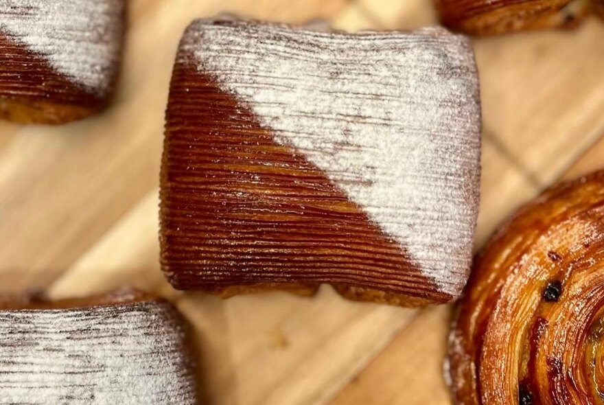 Close-up of pastries on a wooden board.