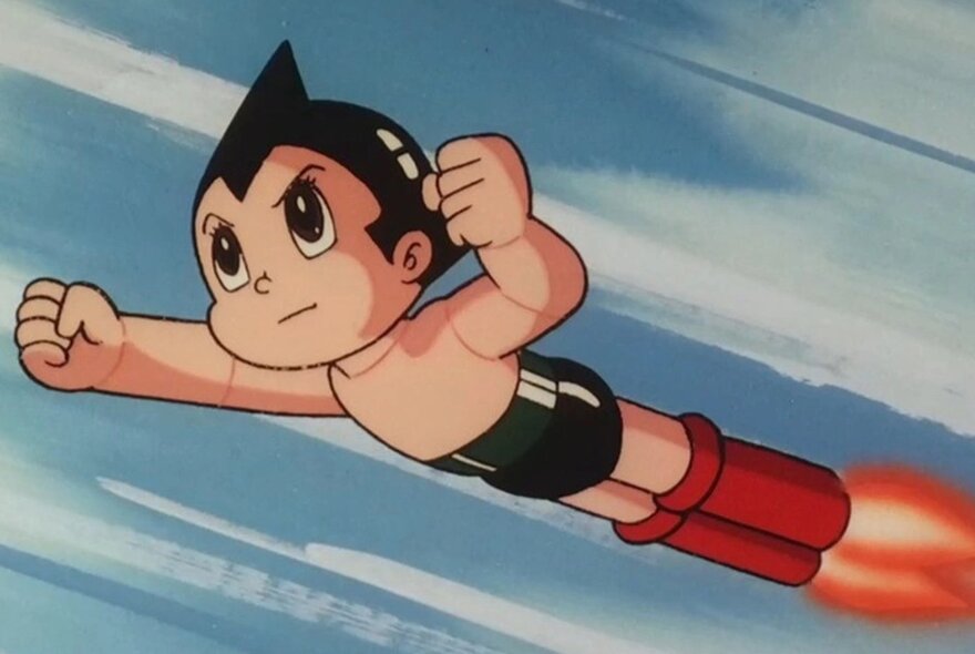 Astro Boy cartoon character flying through the air with jet-propelled boots.