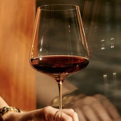 A glass of red wine.