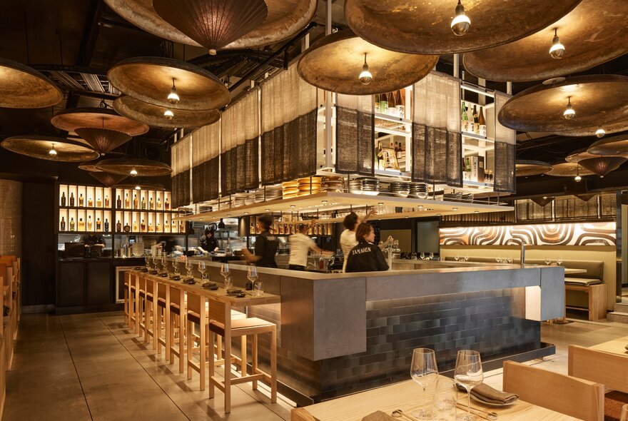 Central bar at Yamagen with stools on one side.