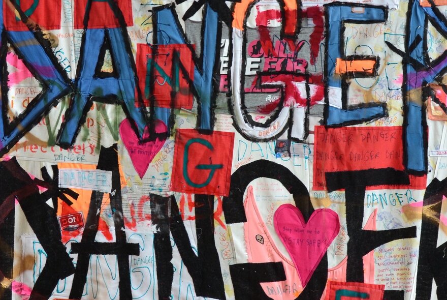 Slogan-style artwork with letters and words on linen canvas.