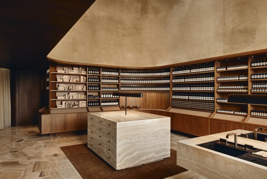 The stylised interior of an Aesop shop, all clean lines and uniform products. 