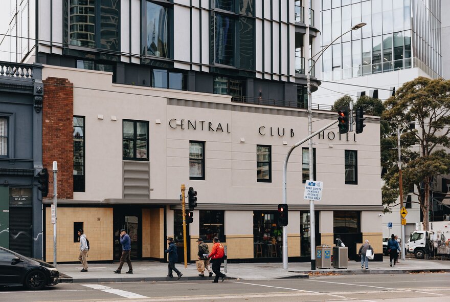 Central Club Hotel in North Melbourne, 1930s building topped by glass apartment building.