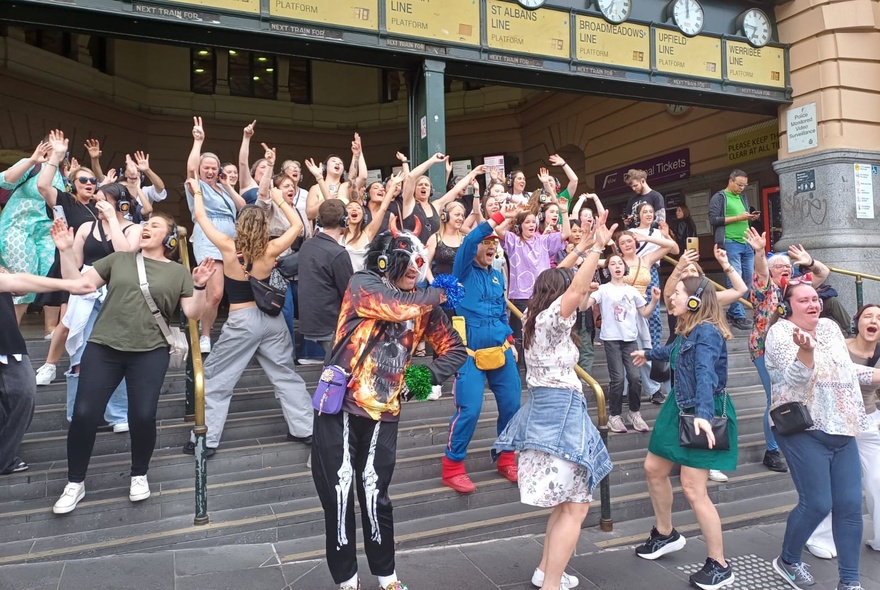 Flashmob group on the steps of Flinders Street Station.