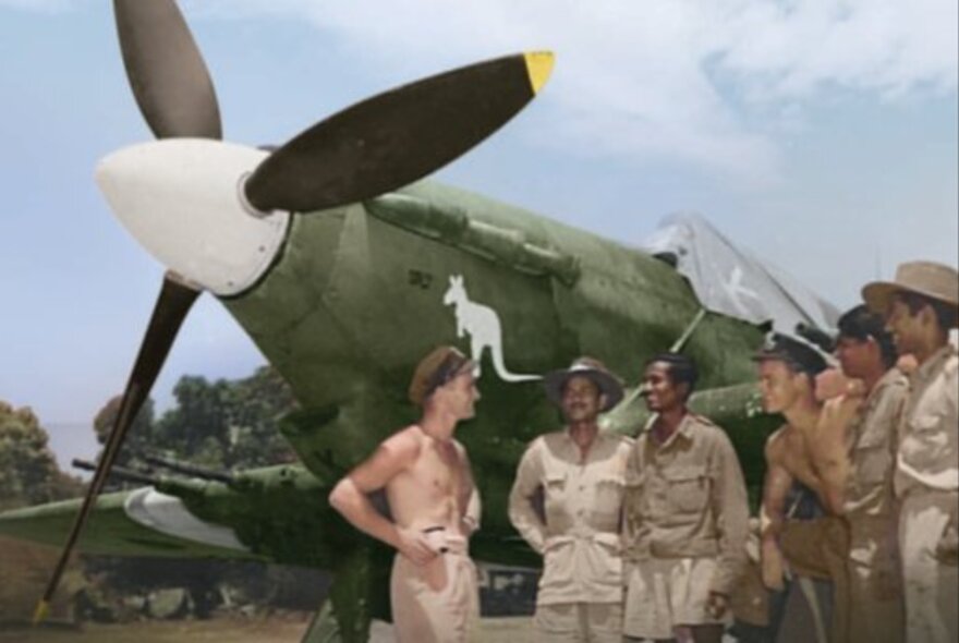 RAAF personnel standing in front of a World War II airplane in Burma; image dating from the 1940s.