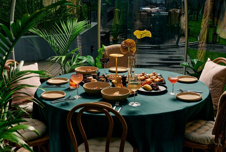 Set table with dishes of food and cutlery.