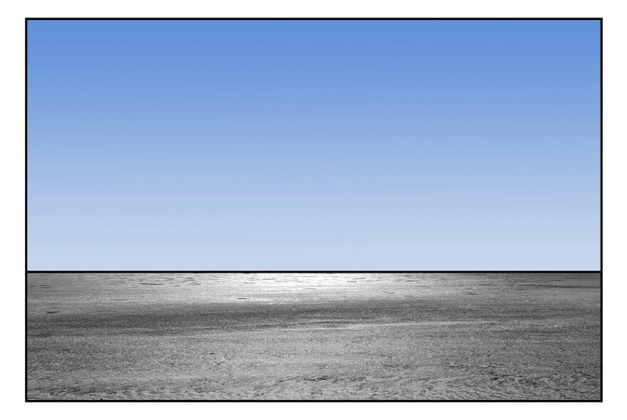 Horizon made up of clear blue sky and grey land.