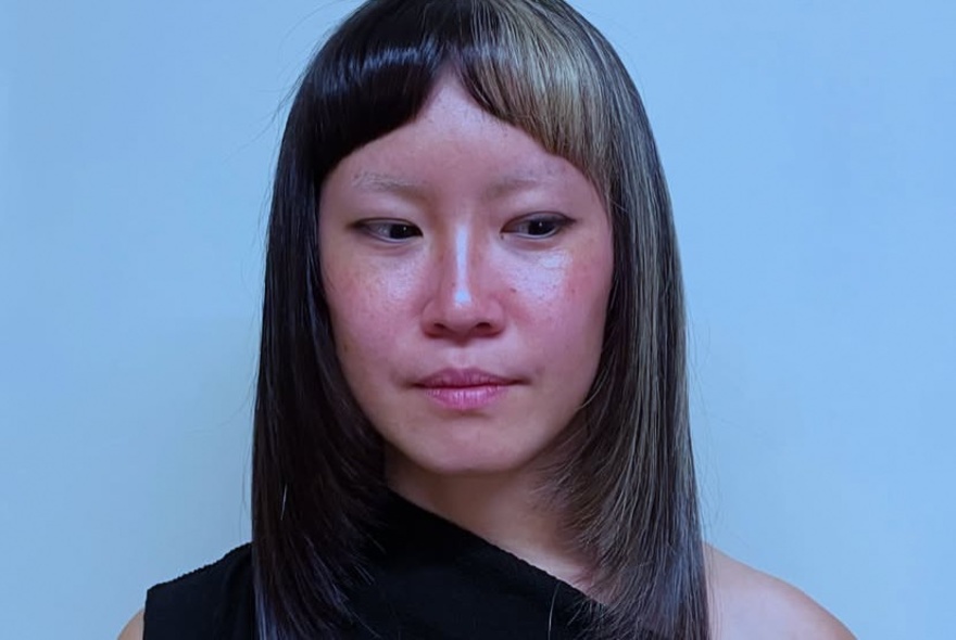 A woman with an interesting haircut and two toned fringe.