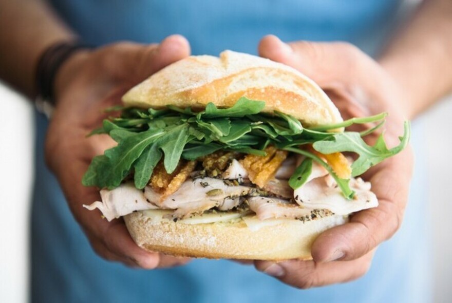 Italian panini sandwich of chicken and rocket.