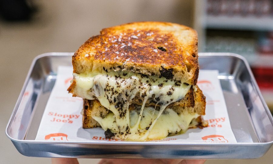 A cheese toastie on a silver plate