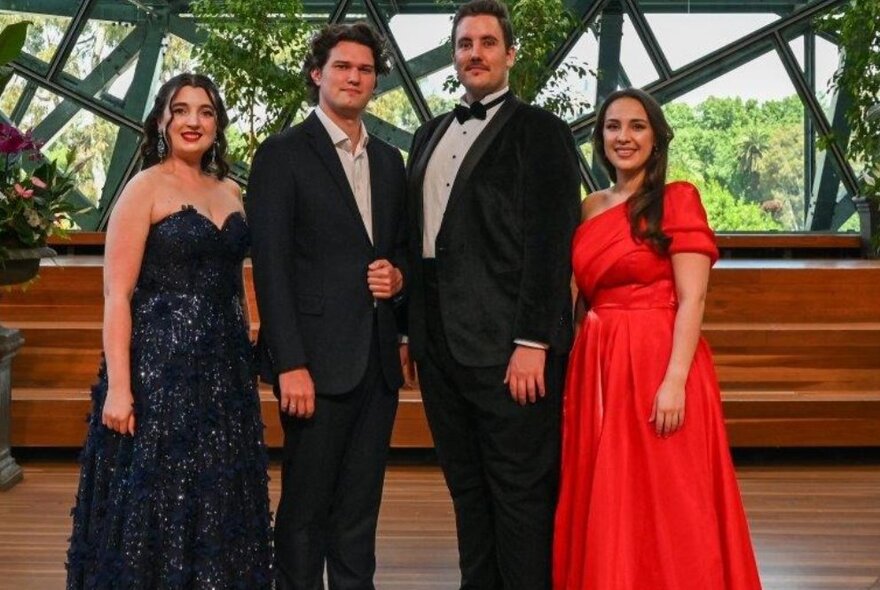 Four performers wearing formal wear on stage at the Edge.