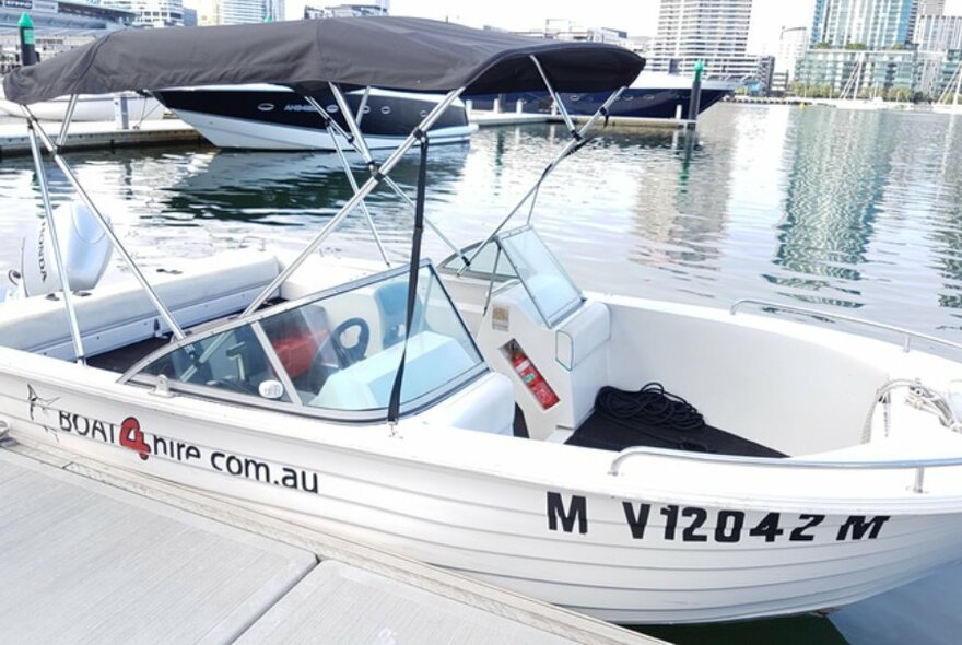 A fishing speed boat on the water. 