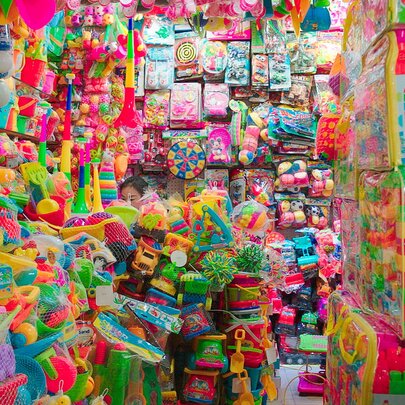 Inside a small shop filled with sparkly decorations and plastic novelty goods.