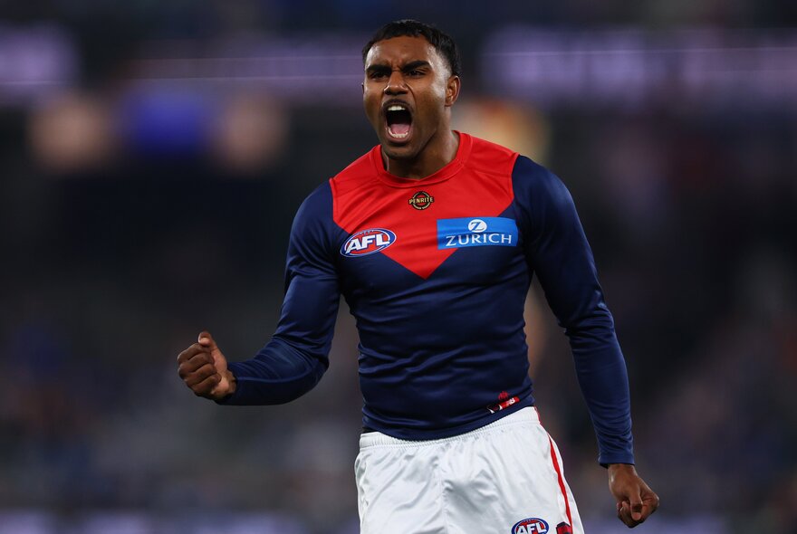 Melbourne player Kozzy Pickett celebrates with a fist pump. 