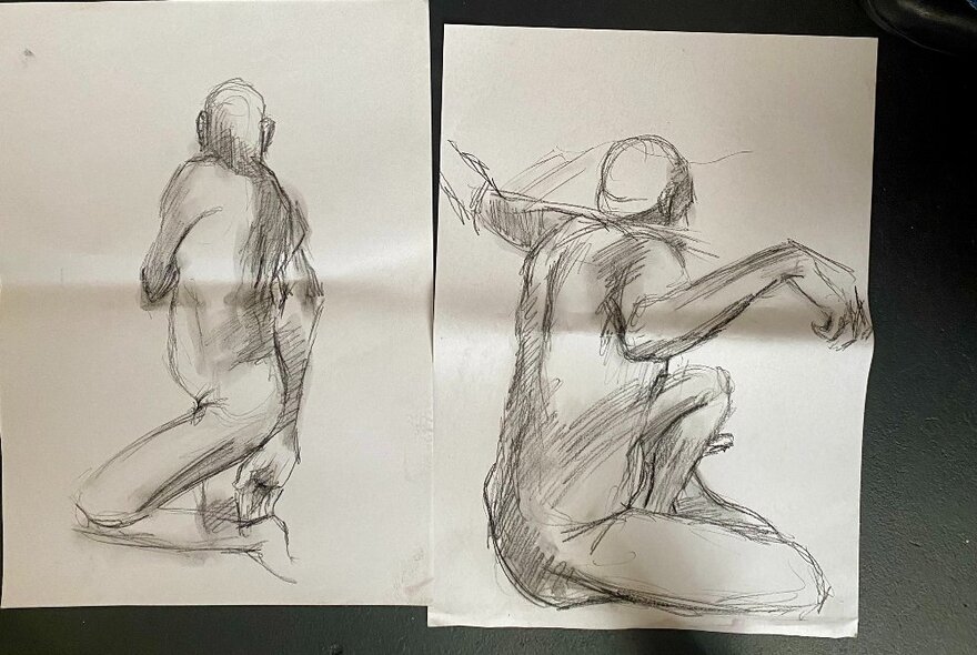 Two life drawing sketches on paper.