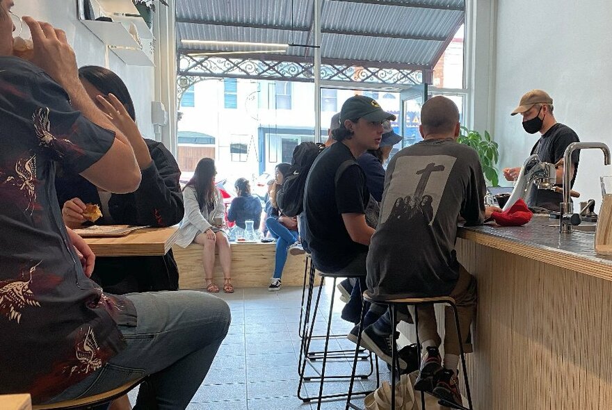 The interior of a busy cafe 