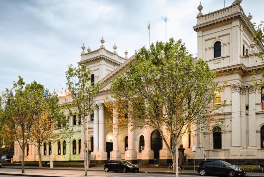 Trades Hall building on Lygon Street, mid-Victorian classical public building with pedimented portico with columns and turrets.