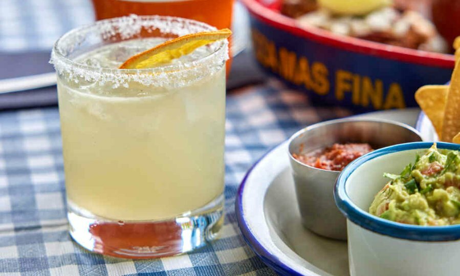 A margarita on a gingham table cloth