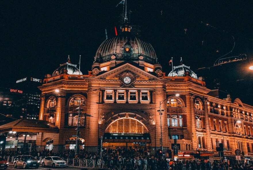 Flinders Street Station illuminated at night.