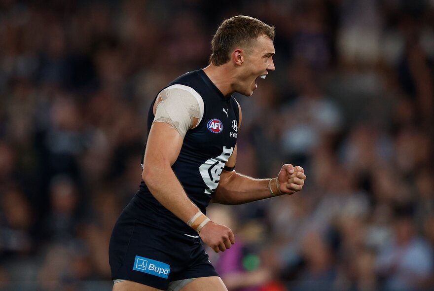 Carlton AFL football player on the field during a match.