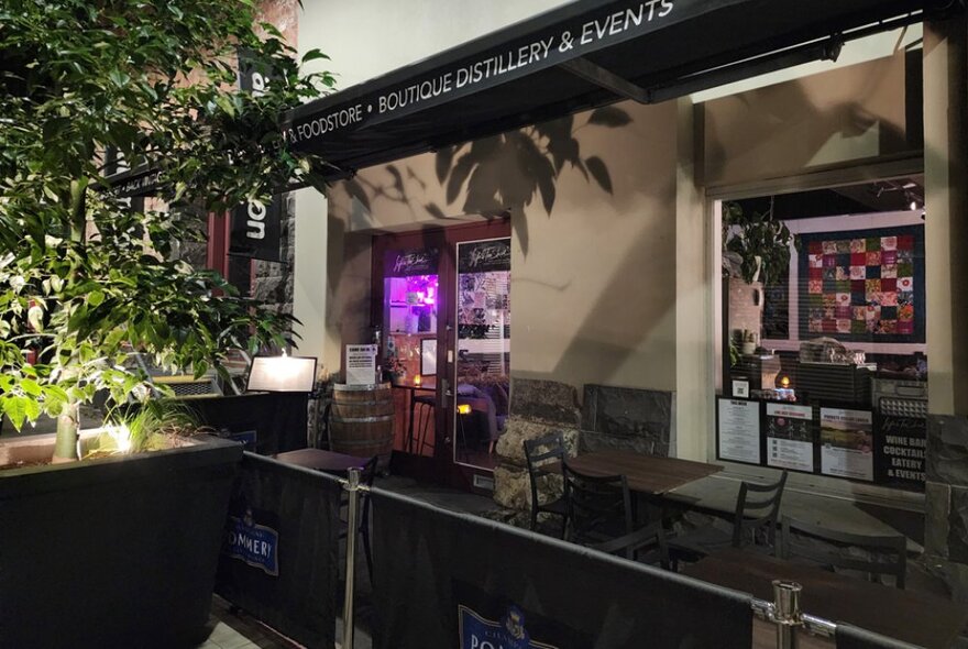 Bar and seating area in an open-air cafe.