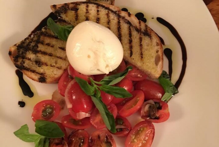 Bruschetta with tomatoes and fresh mozzarella.