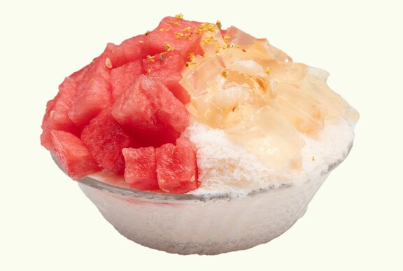 A watermelon shaved ice dessert, topped with lychee jelly and fresh watermelon.
