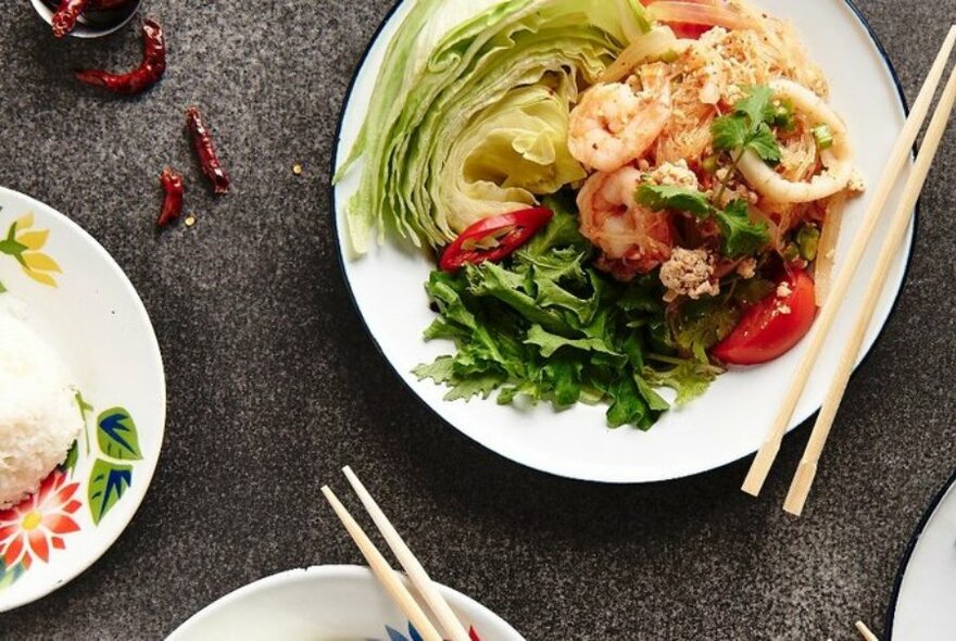 Thai prawn salad and chopsticks.