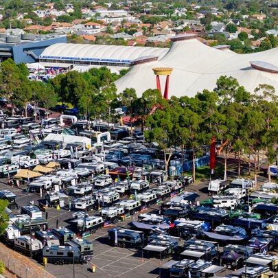 An aeiral view of the Melbourne showgrounds carpark filled with caravans and campers on display.