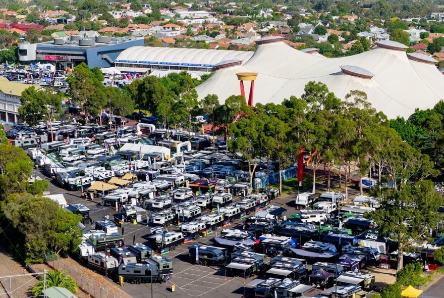 An aeiral view of the Melbourne showgrounds carpark filled with caravans and campers on display.