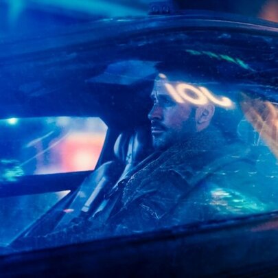 Movie still of Ryan Gosling in a car.