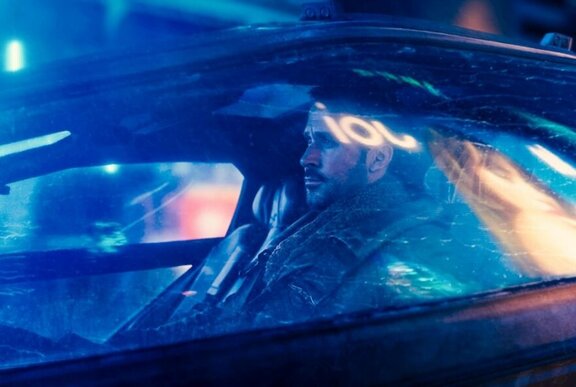 Movie still of Ryan Gosling in a car.