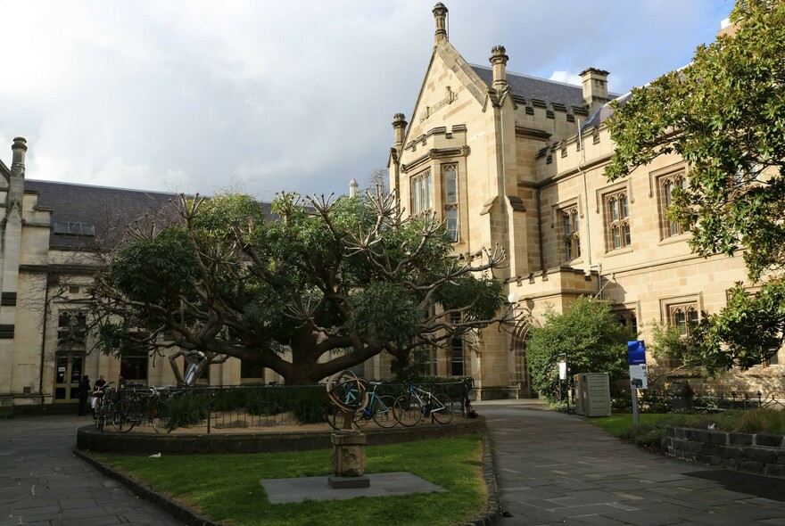 A courtyard and historic building at University of Melbourne.