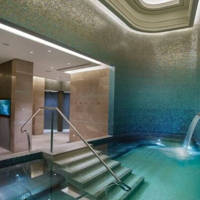 The spa at Crown Towers, with a deep pool and a comfortable booth area to relax in.