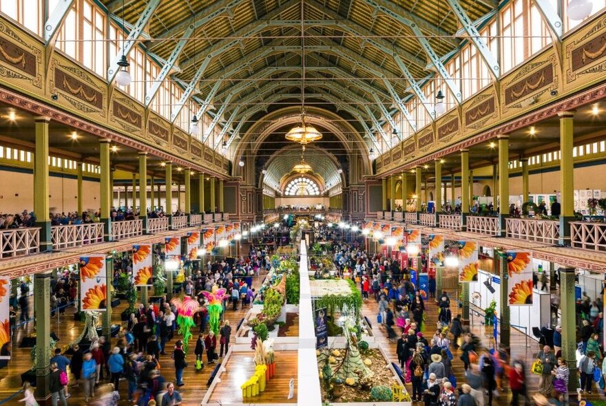 The large domed hall at Melbourne's Royal Exhibition Building, with patrons milling around stalls at the International Flower and Garden Show.