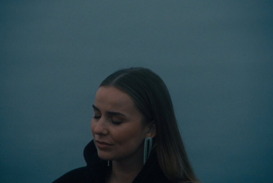 Singer and songwriter Ellen Bryant, looking peaceful with her eyes closed.