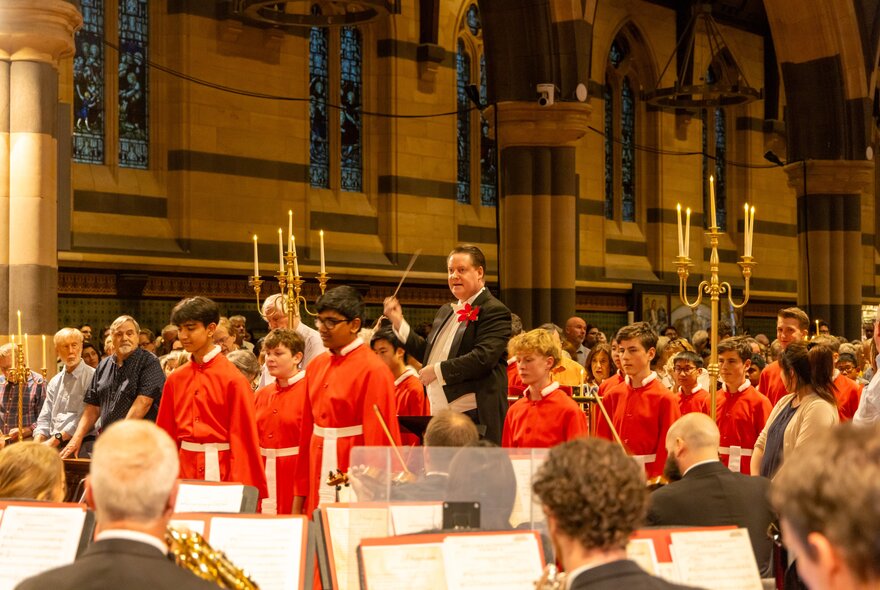 The conductor of the Royal Melbourne Philharmonic orchestra in St Paul's Cathedral, Melbourne.