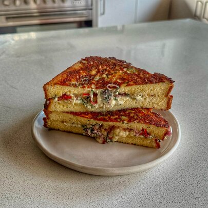 Grilled cheese toastie on a plate.