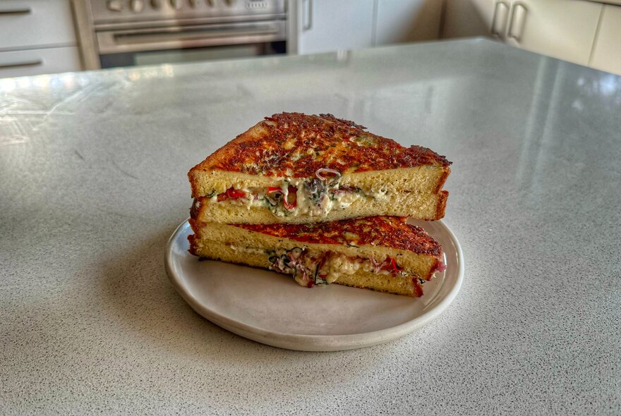 Grilled cheese toastie on a plate.