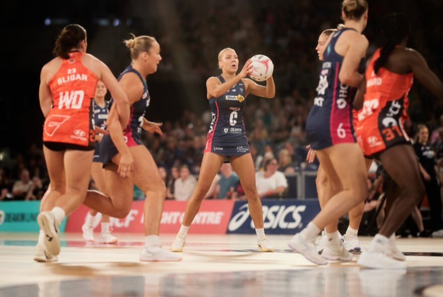 A netball match featuring the Melbourne Vixens and the Giants. 