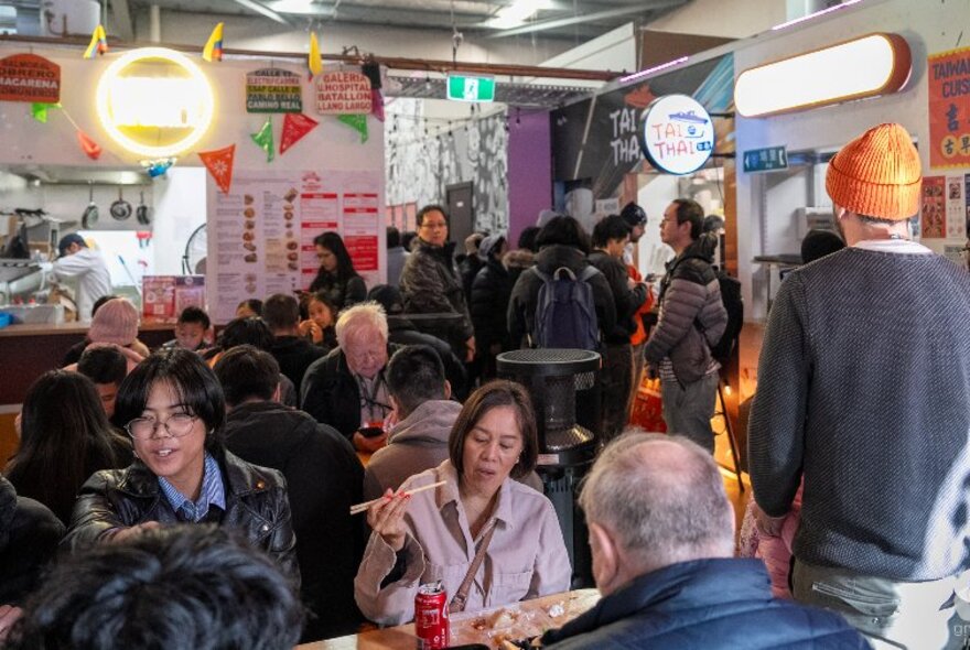 People dining at tables in a casual venue.