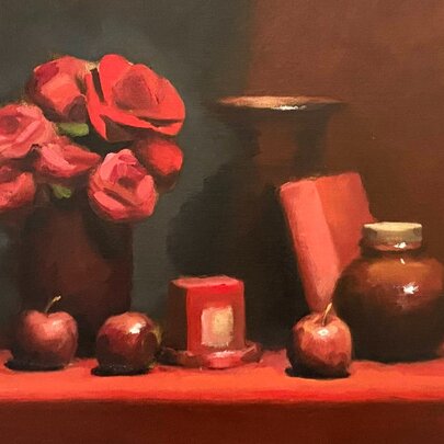 Oil painting of a still life featuring red flowers in a dark vase, paired with ceramic jars, a red book, and scattered red apples on a red tabletop.