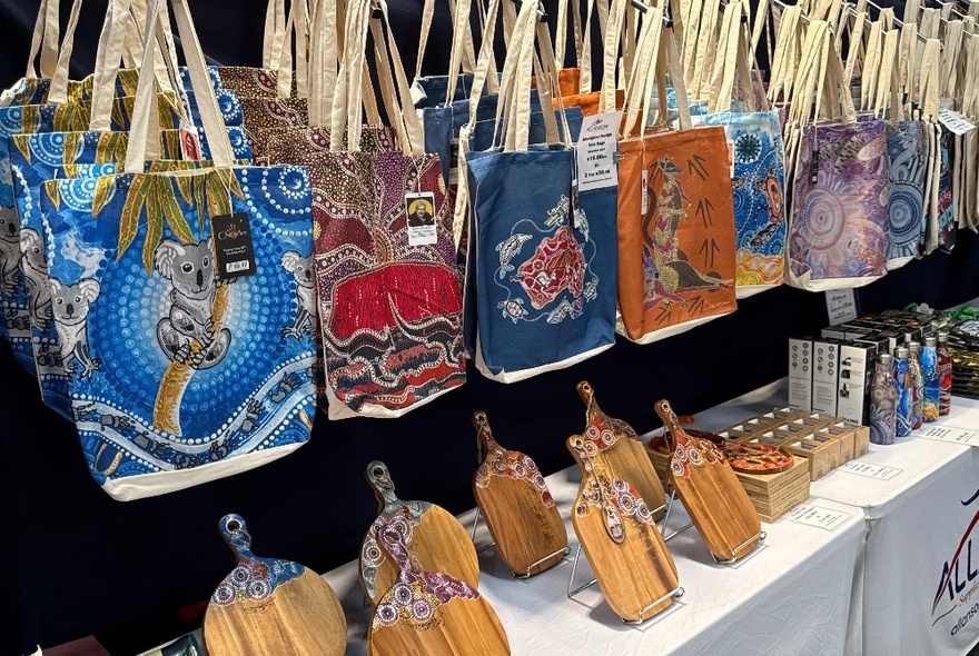 Rows of Australian-themed souvenirs and tote bags on display at at stall at Queen Victoria Market.